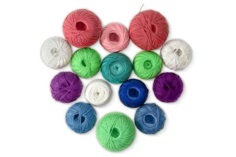 Multi-colored wool balls, yarn in shape of heart on white isolated background Stock Photos