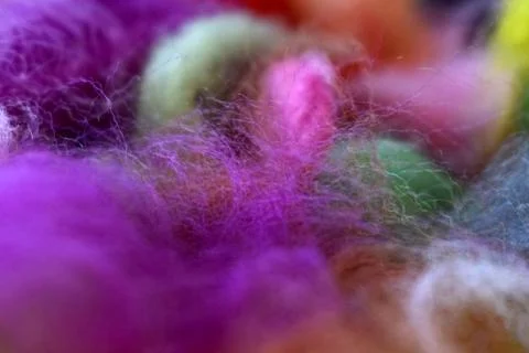 Multi-colored wool for felting. Materials for needlework and creativity. Stock Photos