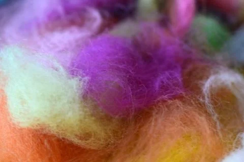 Multi-colored wool for felting. Materials for needlework and creativity. Stock Photos