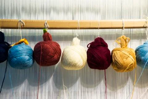 Multi-colored wool yarn on a loom for carpets Stock Photos