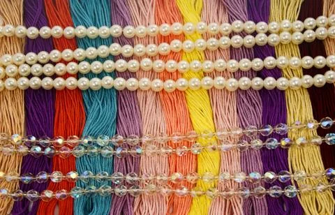 Multi-colored yarns. Pearls and glass beads. Stock Photos