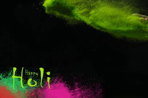 Multi - Colorful dust explode at black background. Celebrate Indian Holi fest Stock Photos