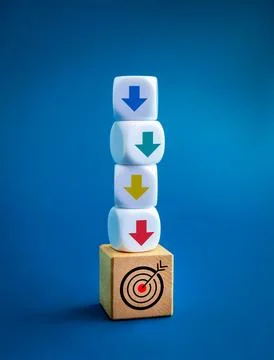 Multi colors down arrows on white block stack soaring down on target icon o.. Stock Photos