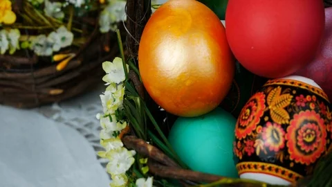 Multi colors easter eggs in the spring bascket Stock Footage 87856187