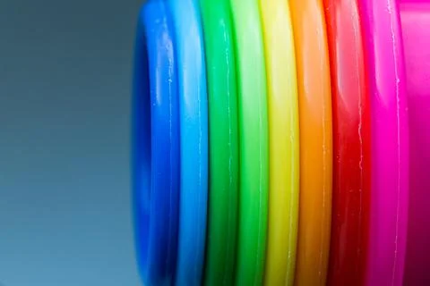 Multi colour plastic object. Colourful close up vertical pattern of children toy Stockfoto's