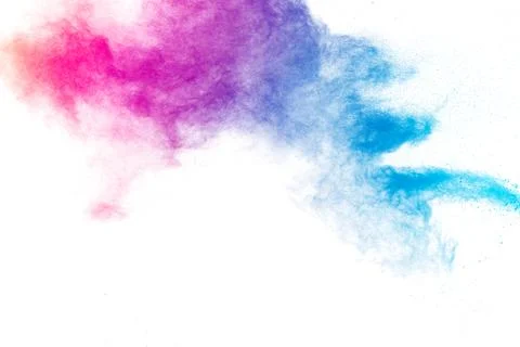 Multi colour powder explosion on white background. Stock Photos