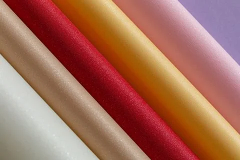 Multi-coloured background of twisted cardboard with sequins Stock Photos