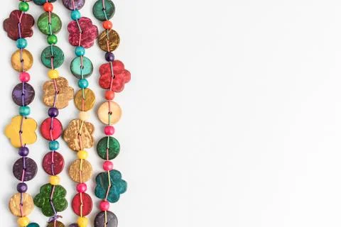 Multi coloured beads hand made from coconut shell, flowers and rounded pieces Stock Photos