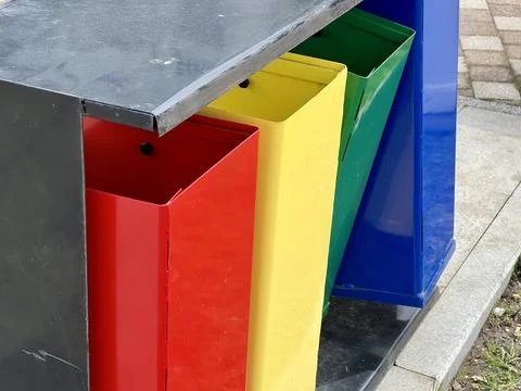 Multi-coloured containers for secondary raw material and waste collection. Stock-Fotos