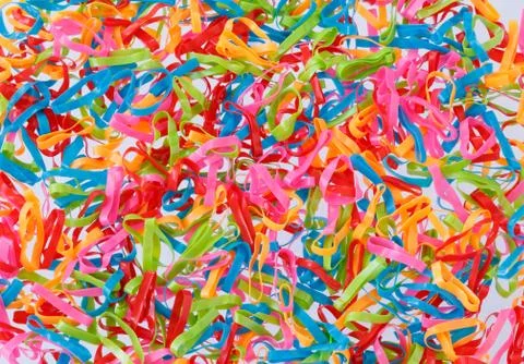 Multi coloured elastic bands background Stock Photos