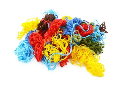 Multi-coloured embroidery threads in a tangled heap Stock Photos