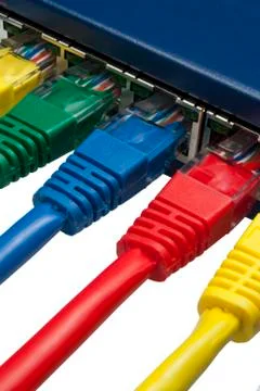 Multi coloured ethernet network plugs connected to a router / switch Stock Photos
