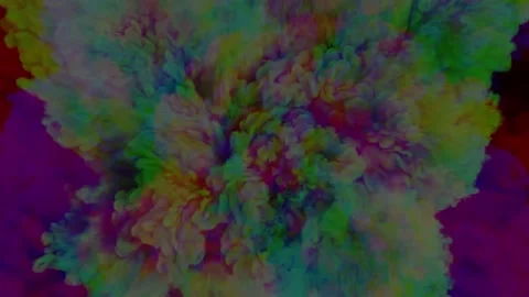 A multi-coloured explosion emits multi-coloured smoke on a black background. Stock Footage 239458549