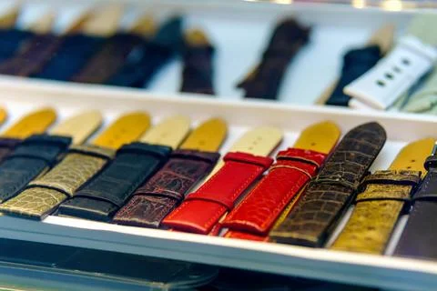 Multi-coloured leather watch straps on the counter Stock-Fotos