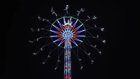 Multi Coloured Merry-Go-Round Rotating Fast. Amusement Park, Fair at Night Stock Footage 197604883