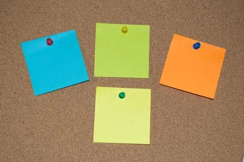 Multi Coloured Post it Notes on a Cork Board Stock Photos