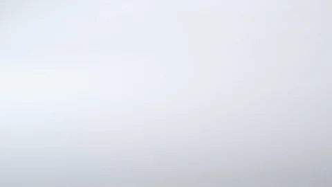 Multi-coloured push pins rolling into frame on a white surface Stock Footage 117350201