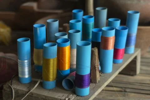 Multi coloured silk reels in traditional cambodian workshop Stock Photos