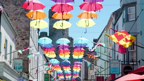 Multi coloured umbrellas infront of Caernarfon Castle Video stock 190073704