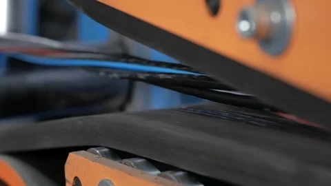 The multi-core cable in the shell moves along the conveyor line. Stock Footage 125414028