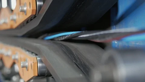 The multi-core cable in the shell moves along the conveyor line. Stock Footage 125475472