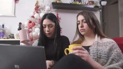 Multi-ethic women using laptop and shopping online for Christmas gifts Video stock 133374733