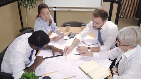 Multi-ethnic architects working on house project together. Stock Footage 101788561