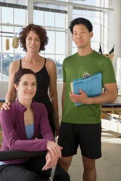 Multi-ethnic business owners in exercise studio Stock Photos