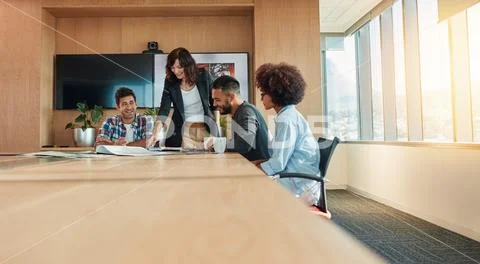 Multi ethnic business people meeting in conference room Stock Photos