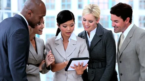 Multi Ethnic Business Team With Wireless Tablet Stock Footage 7907797