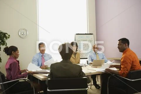Multi-ethnic businesspeople at meeting Stock Photos