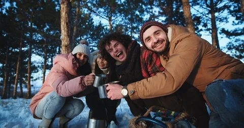Multi ethnic charismatic group of friends traveling in a winter in the middle of Stock Footage 112634650
