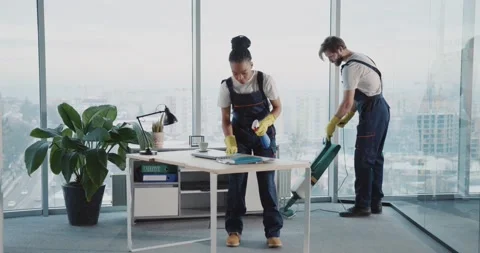 Multi-ethnic cleaning services team couple of african woman and caucasian man Stock Footage 149263428