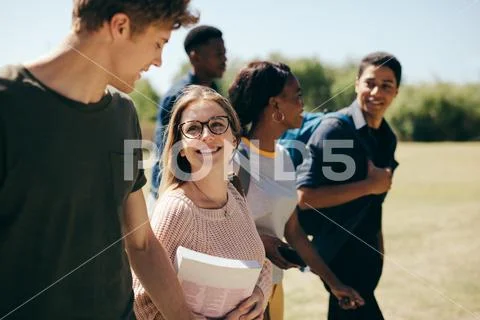 Multi-ethnic college students at campus Stock Photos