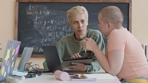 Multi-Ethnic College Students Studying Computer Science Together Stock Footage 257059407