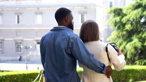 Multi-ethnic couple gesturing success while taking selfie in a park Stock Footage 291516365