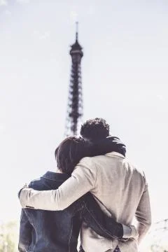 Multi-ethnic Couple Having Fun In Paris Near Eiffel Tower Fotos Stock