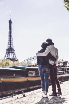 Multi-ethnic Couple Having Fun In Paris Near Eiffel Tower Fotos Stock
