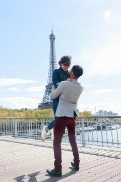 Multi-ethnic Couple Having Fun In Paris Near Eiffel Tower 写真素材