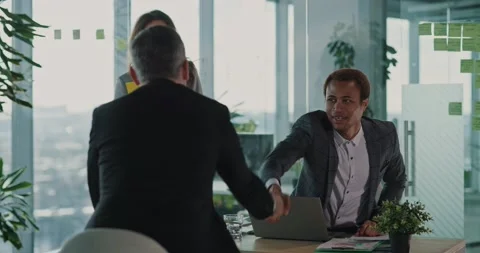 Multi-ethnic couple of hiring managers discussing future job opportunities and Stock-Footage 150114001