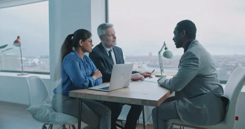 Multi-ethnic couple of hiring managers discussing future job opportunities Stock Footage 208040885