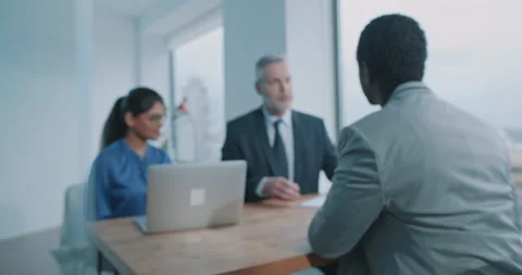 Multi-ethnic couple of hiring managers doing recruit job interview in office Stock Footage 208041034