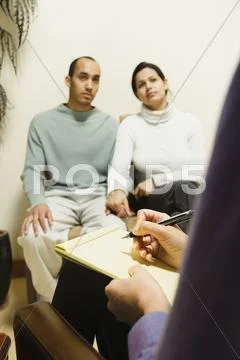 Multi-ethnic couple at therapy session Stock Photos