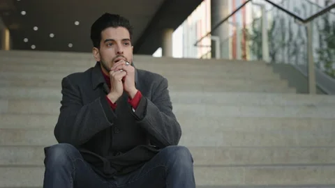Multi Ethnic Depressed Man Sitting on Stairs Outdoors near Office Center Stock Footage 237605443