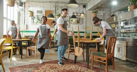 Multi-ethnic different people waiters in medical masks in cafeteria restaurant Stock Footage 229928250