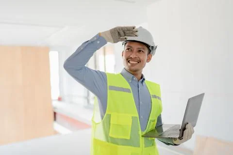 Multi ethnic engineer brainstorming and measuring for cost estimating on Stock Photos