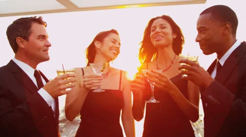 Multi ethnic friends drinking toasting at luxury outdoor cocktail party Stock Footage
