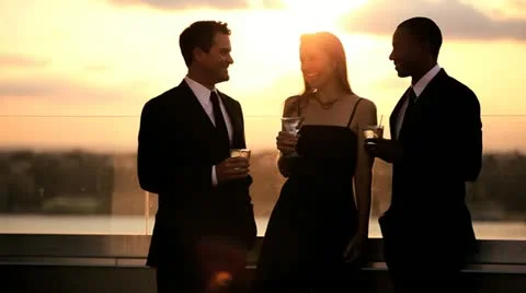 Multi ethnic friends toasting with cocktails and gossiping at roof luxury party  Stock Footage