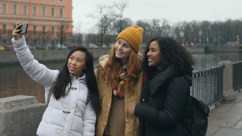 Multi Ethnic Girls Making Funny Faces And Smiling For Selfies In City 4k Видео 98564756