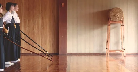 Multi-ethnic group of athletes practicing Japanese traditional Kyudo archery Stock Footage 78079035